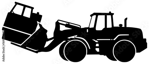 Loader moving heavy cargo and loading large rocks with massive machines underground