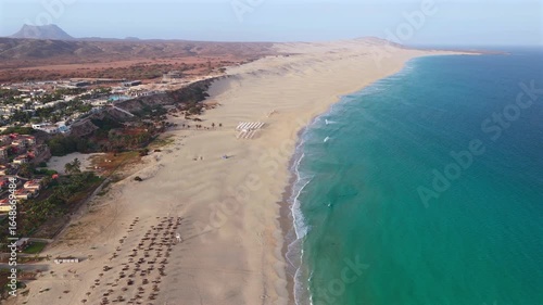 Wallpaper Mural Aerial view of Chaves beach (Praia de Chaves) parasol,sandy beach, famous resort and background a volcanic mountain.Boa Vista island in the Atlantic Ocean.Cape Verde, Africa. Torontodigital.ca