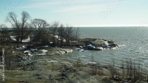 icy Scandinavian sea on a windy day beats on a rocky promontory