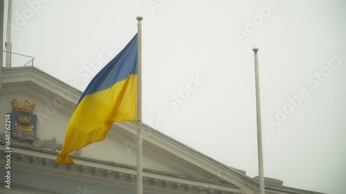 Ukrainian flag waving on a pole