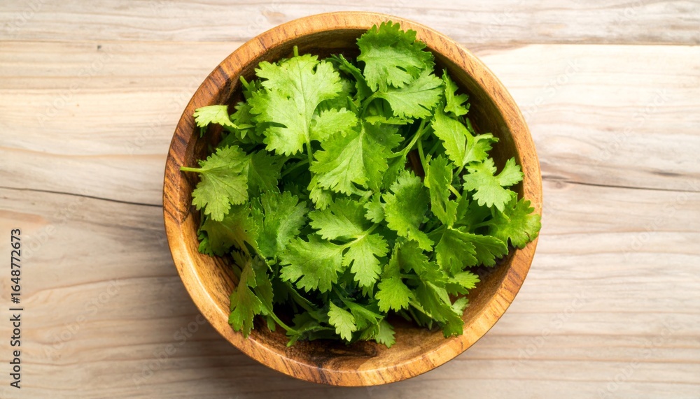 Fresh organic green salad with parsley, spinach, and other vegetables in a wooden bowl on a white isolated background Fresh organic green salad with parsley, spinach, and other vegetables in a wooden bowl on a white isolated background