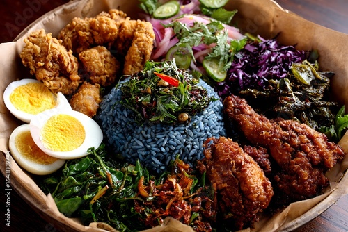 Wallpaper Mural Traditional Kelantanese nasi kerabu with blue rice ulam-ulaman, budu and fried chicken  Torontodigital.ca