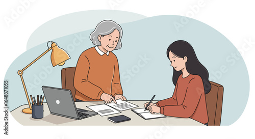 Two people one elderly woman and a younger woman sit at a desk with a laptop