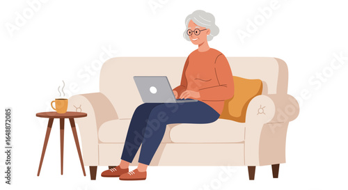 Woman on a couch with a laptop and coffee