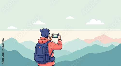 Adventurer Capturing Mountain Vista With Mobile Phone On Hazy Day