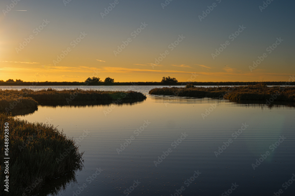 Fototapeta premium sunset over the lagoon, Po river delta, Comacchio, Ferrara, Italy