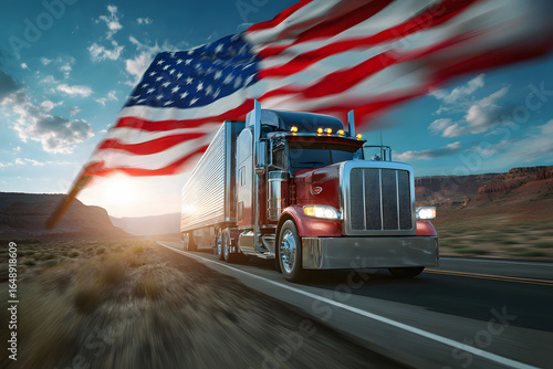An American-style large truck is in transit. An impressive scene of the truck driving on the highway with the American flag in the background.