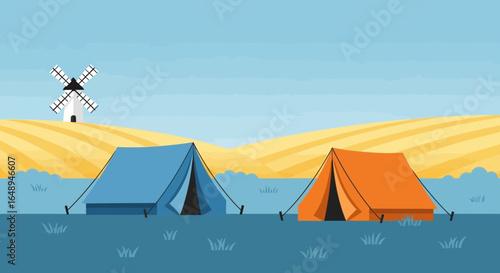 Colorful Tents Near A Scenic Windmill In An Open Field Landscape