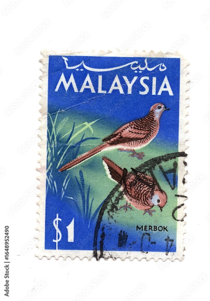 Fototapeta premium A vintage postage stamp from Malaysia isolated on a white background.