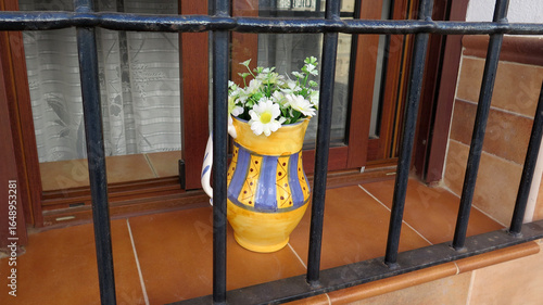 Colorful jug with wild flowers