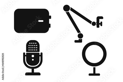 Equipment layout for a podcasting studio featuring a microphone, light, and an audio interface