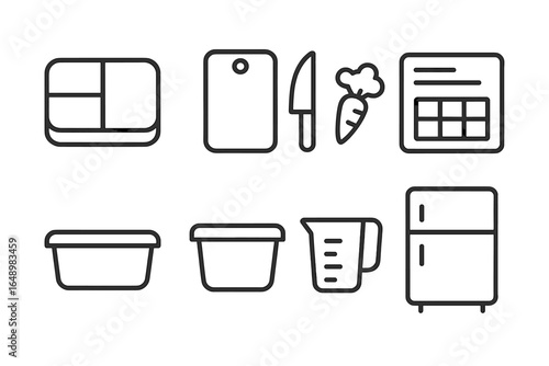 Kitchen tools and storage containers set up for meal preparation and organization in a home kitchen space