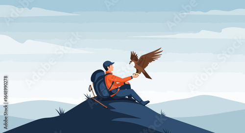 Hiker Reaching Mountain Summit with Eagle Resting Calmly on his Arm