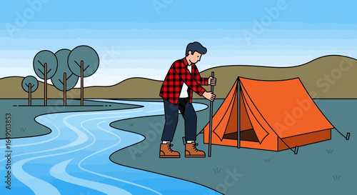 Man Sets Up His Orange Camping Tent Near The River In Nature Landscape