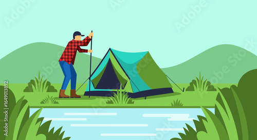 Man Setting Up Camp Near Tranquil Lake On Beautiful Sunny Day