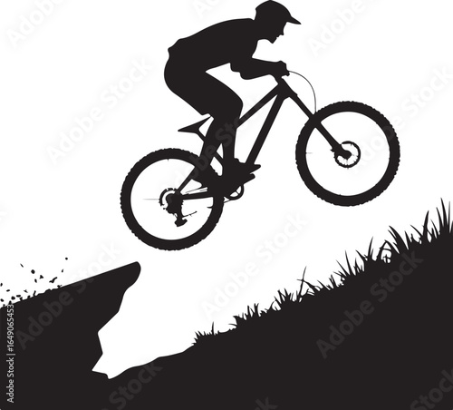 Extreme cyclist jumps cliff edge in dynamic action silhouette
