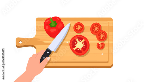 Top view of a hand with a knife slicing fresh red tomatoes and a bell pepper on a wooden cutting board, concept of cooking and healthy eating.