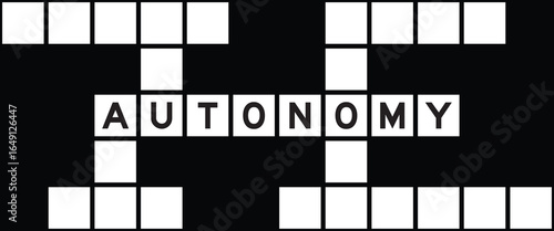 Alphabet letter in word autonomy on crossword puzzle background