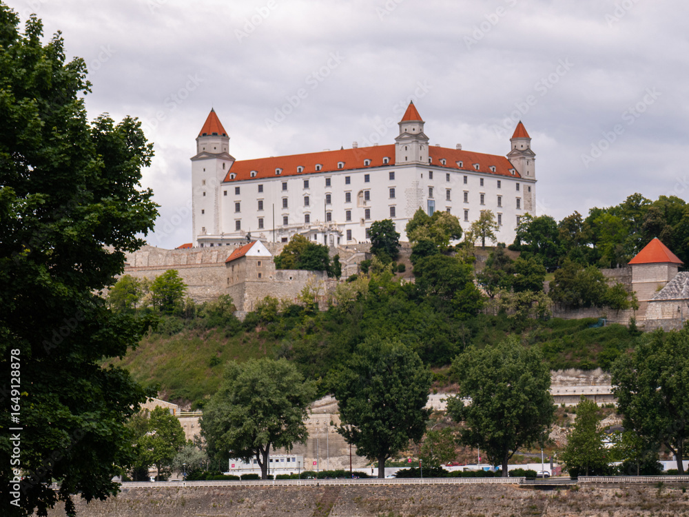 Hilltop castle with red roofs and white walls, ideal for illustrating history, heritage, and travel concepts. Hilltop castle with red roofs and white walls, ideal for illustrating history, heritage, and travel concepts.