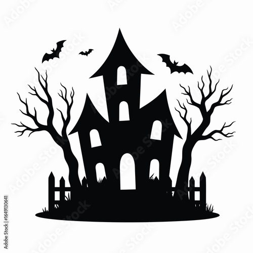 Black silhouette of haunted house with bats and bare trees