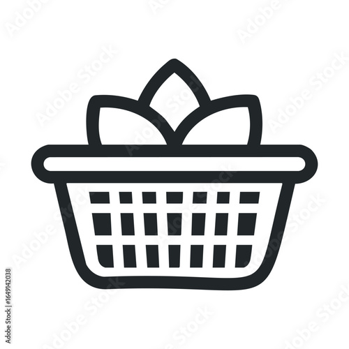 Modern wicker basket filled with fresh leaves for eco friendly design