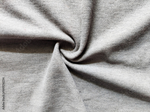 Gray fabric cloth rolled into a circle to wallpapers, backgrounds, and textures for design.