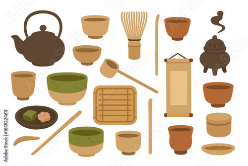Collection of traditional tea ceremony utensils displayed on a flat surface for preparation and serving of tea