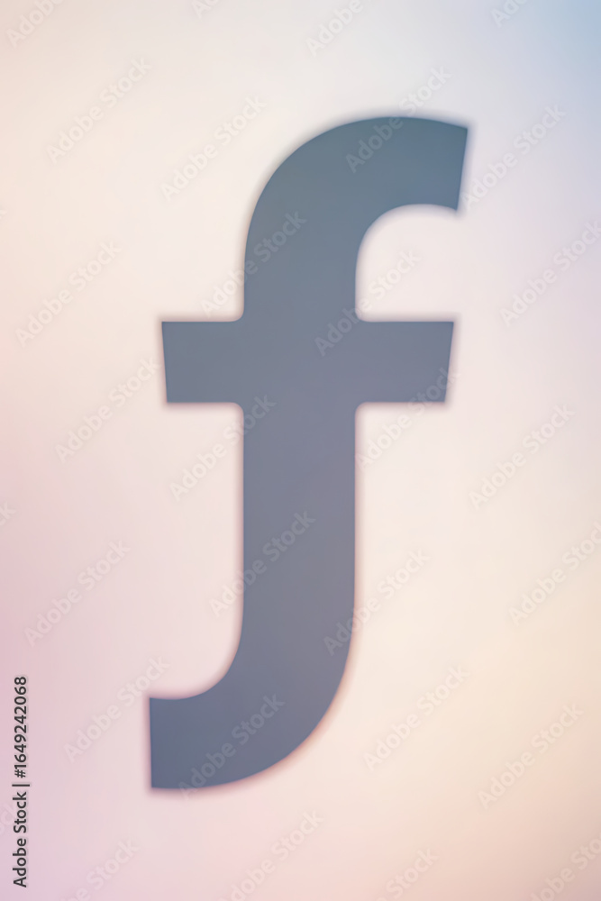 Obraz premium Soft and elegant lowercase f silhouette against blurred pastel backdrop, clean professional design, visual focus on shape