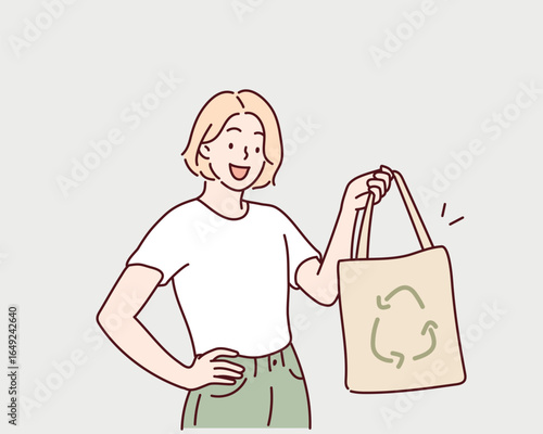 Young woman holding eco friendly reusable tote bag. Hand drawn style vector design illustrations.Web