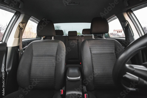 Front Interior View of Modern Car with Black Fabric Seats