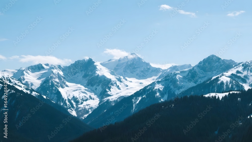 Fototapeta premium Snow-Capped Mountain Range Under a Clear Blue Sky