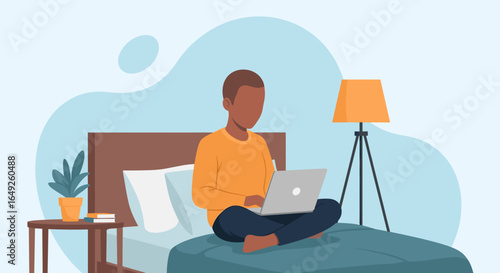 Young person works remotely from the comfort of their bed using a laptop. Ideal for concepts of home office, online learning, and flexible lifestyle.