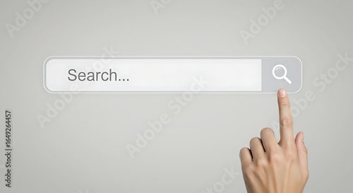 A hand pointing towards a search bar, ready to initiate an online inquiry.