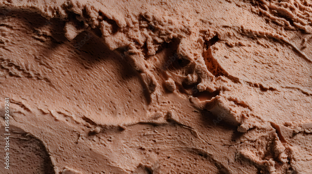 Fototapeta premium Chocolate ice cream texture close-up, emphasizing creamy consistency and rich cocoa taste