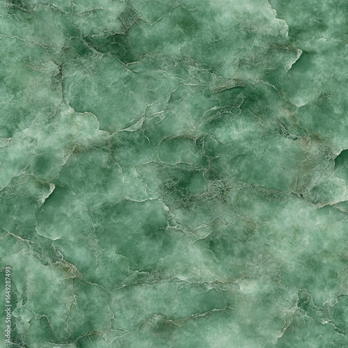 A luxurious and serene green marble texture with delicate white veining, creating a rich and elegant abstract background for sophisticated interior design projects.
