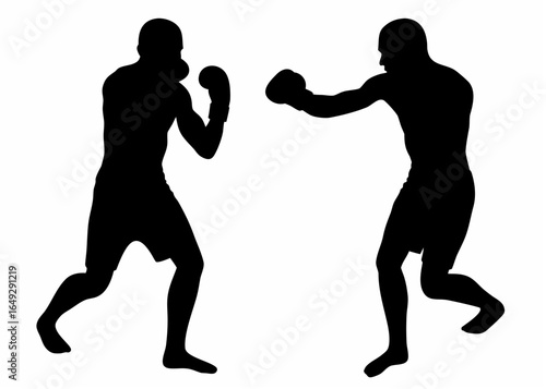 Two boxers in silhouette facing each other and preparing to fight in a boxing match or sparring session