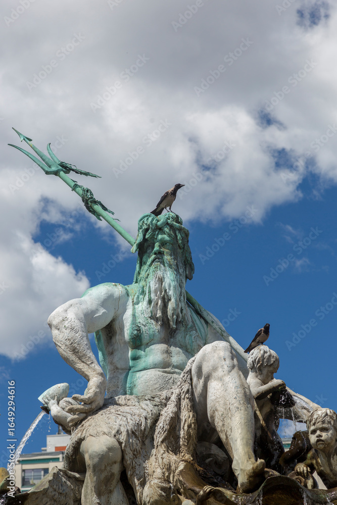 Fototapeta premium Berlin, Germany - July 01, 2018: Fragment of the Neptune Fountain in the center of Berlin