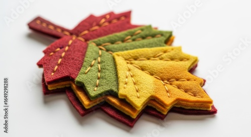 Hand-crafted felt leaf on a solid white background, handmade miniature