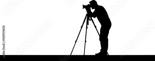 Silhouette of photographer with camera on tripod capturing special moments in a studio