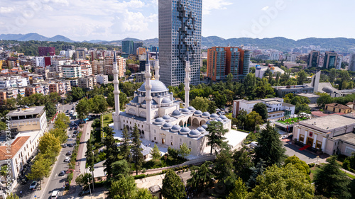 Aerial orbits bright white Namazgah Islamic Mosque in Tirana, Albania