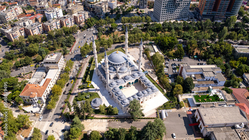 Aerial orbits bright white Namazgah Islamic Mosque in Tirana, Albania
