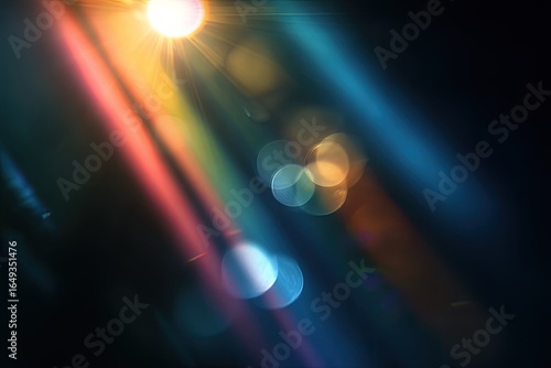 Abstract light streaks and lens flares on a dark background