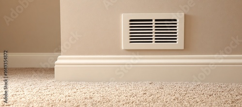 Heating vent blowing air in carpeted room