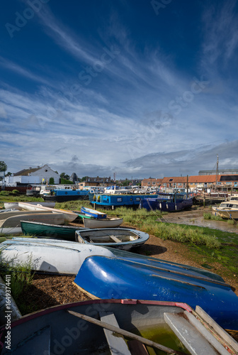 Wallpaper Mural Small boats on a sunny day. View of the quay at low tide on the River Deben in the historic town of Woodbridge in Suffolk, UK. Torontodigital.ca