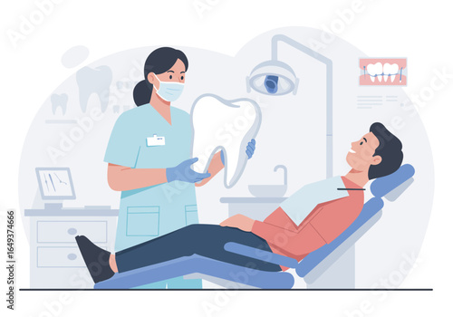 Caring dentist showing tooth model to patient for treatment in modern clinic, promoting dental health