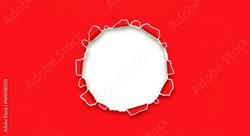 A torn red paper with a white circle revealing a hole.