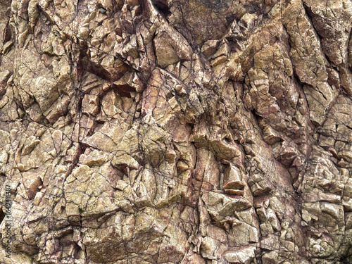 A close-up view of textured rock surfaces showcasing intricate patterns and natural formations, emphasizing the Earth's geological features.
