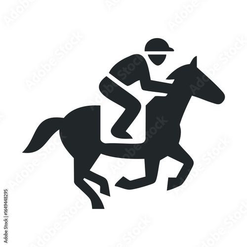 Silhouette of a jockey on a galloping horse in motion