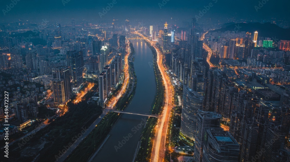 Fototapeta premium Night cityscape Aerial view of illuminated city skyline at dusk river and highway