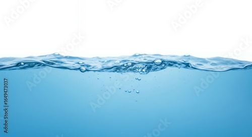 Clear water surface with multiple air bubbles and dynamic waves creating natural underwater effect on blue background